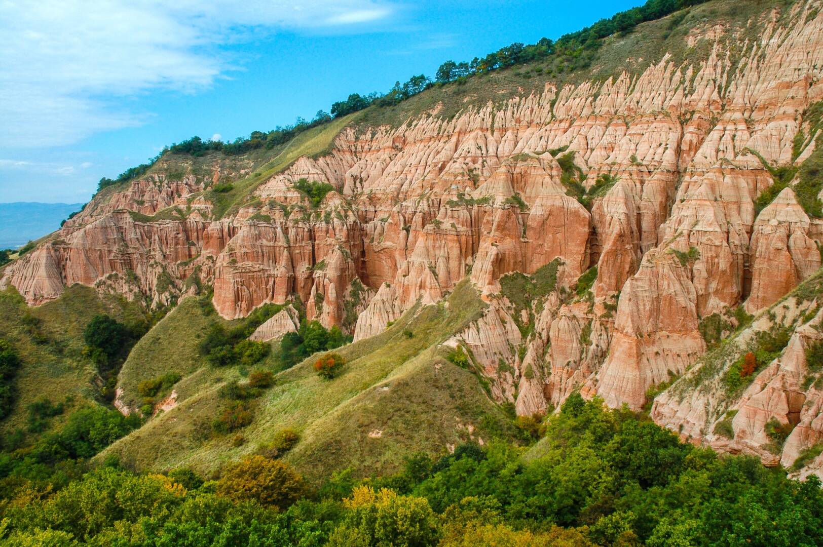 Succession of red and white clays with dinosaur fossils. Geological reserve of Rapa Rosia, Romania